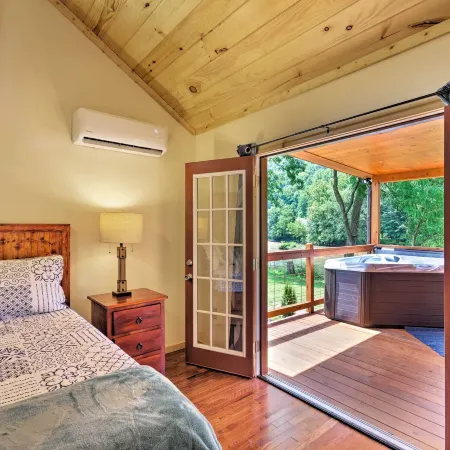 Deck & Hot Tub: Bryson City Riverfront Cabin!