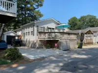 Charming Beach Cottage with Outdoor Shower and Golf Cart - Delightful Escape