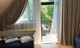 a room with two beds , one on the left side and the other on the right side of the room at Sunrise Beach Villa