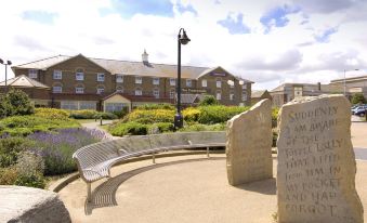 "a large stone bench is located in front of a building with the words "" save any water "" written on it" at Margate