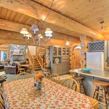 Luxury Riverfront Log Cabin Near Stevens Pass with Hot Tub & Two-Story Fireplace