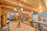 Luxury Riverfront Log Cabin Near Stevens Pass with Hot Tub & Two-Story Fireplace