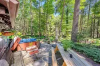 Rustic Rest Log Cabin, with hot tub and trout stream, near Poconos attractions.