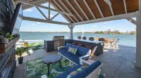 Lake front 4-bedroom vacation home with pool and  tiki bar!