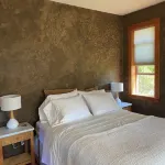Bright art-filled home, fruit trees, valley view