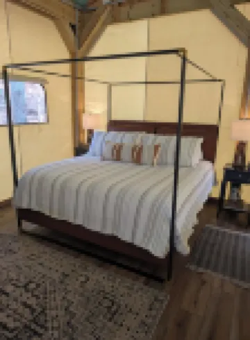 Custom Design Safari Tent Overlooking a Serene Running Creek & Natural Waterfall