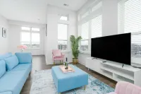 Spacious Living Area and Fully-Equipped Kitchen - Elegant Urban Retreat