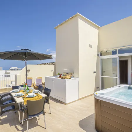 Summer Breeze Penthouse with Large Terrace and Hot Tub by Getaways Malta