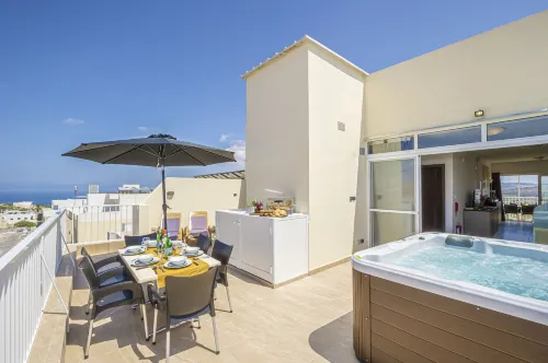 Summer Breeze Penthouse with Large Terrace and Hot Tub by Getaways Malta - parking