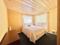 Charming 2-bedroom cabin with lake views offering a quiet, lake-side retreat.