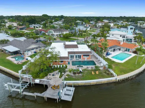 Waterfront Oasis w/ Pool, Spa, Boat & Jet ski Dock, Game Room & Outdoor Kitchen