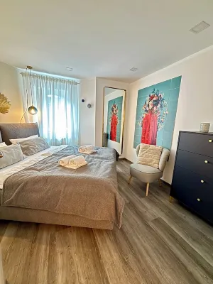 Stylish granny apartment with box-spring bed