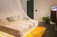 Cozy 2-bedroom cabin in Wayanad, built sustainably amidst lush greener