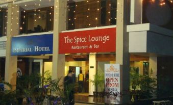 "a building with a sign that reads "" the spice lounge restaurant & bar "" on it" at Imperial Hotel