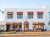 Riviera Beach House Hotels near COACH Outlet