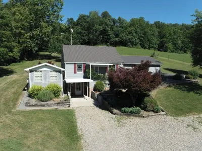 Cozy home in a peaceful country setting with stocked pond. Relax and unwind.