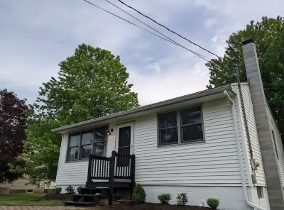 Beautiful home with 150ft sandy beach and private boat launch on Big Sebago!!!!!