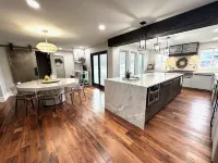 High-end home w/ fireplace, gourmet kitchen, sauna, game rm/ large yard/fire pit