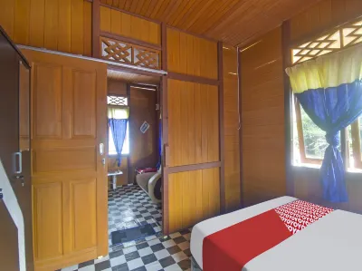 OYO 91246 Pulisan Ekowisata Homestay Near Wisata Pantai Desa Pulisan (Pulisan Beach Tour) Hotel dekat Toko Gunung Kawi