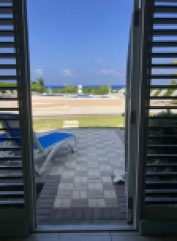 The Harvey Nicole: Modern Caribbean Ocean Front Condo Grand Cayman.