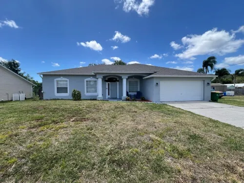 Modern and spacious getaway with a pool and grill