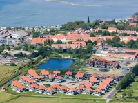 8 person holiday home on a holiday park in Bogense