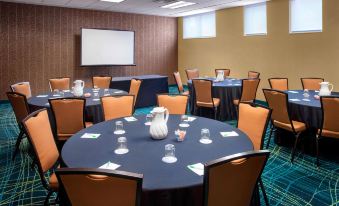 a conference room with tables and chairs arranged in a semicircle , ready for a meeting at SpringHill Suites Philadelphia Willow Grove