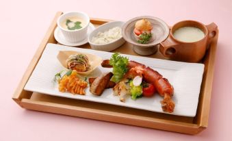 a tray filled with a variety of dishes , including meat , vegetables , and other food items at Okuhita Onsen Umehibiki