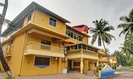 Treebo Majestic Palms, 2 Km from Colva Beach Отели в г. Малгао