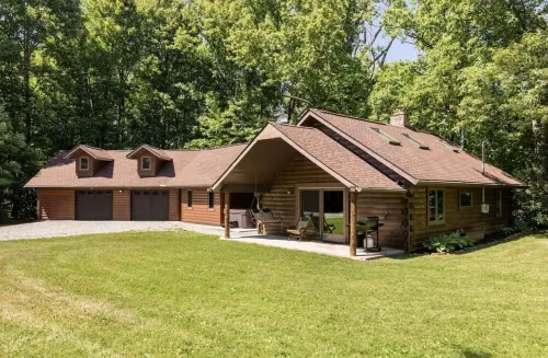 Wooded cabin in the Laurel Highlands with beautiful yard and native trout stream
