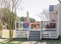 Newly Renovated, 4Bd 2 BA, 1 Full Acre, Sleeps 8, and is Pet Friendly.