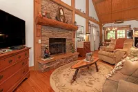 A Laurel Haven, with big porches and a log cabin feel. Fireplace.