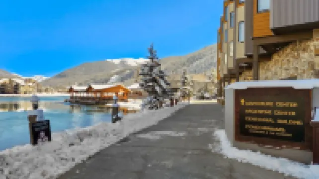 Chic Condo with Stunning Lake and Mountain Views - Inviting Escape