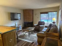 Cozy Living Area with Fireplace and Pool Access - Charming Mountain Escape
