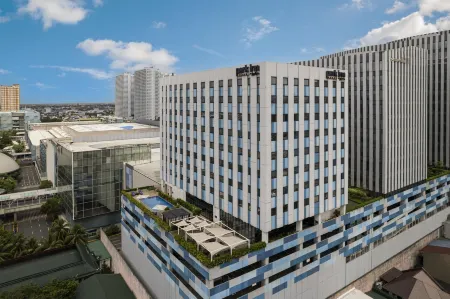 Park Inn by Radisson North EDSA Отели рядом с достопримечательностью «AUG Student Services Manila»