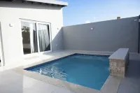 Cozy 1-bedroom apartment in great Palm Beach with AC, WiFi and private pool.