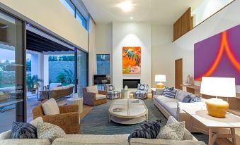 a modern living room with multiple couches and chairs , creating a cozy and inviting atmosphere at Finca Cortesin Hotel Golf & Spa