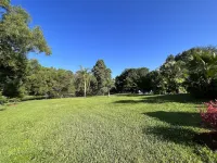 Waterfront Resort Style Oasis ~ 2 Acres, Heated SW Pool, Fire Pit, Outdoor Games Hotels near Orthopedic Center of Palm Beach County