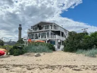 Modern beachfront condo with private deck, harbor views, and parking!