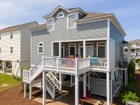 4BR beach getaway steps away from the beach with community pool