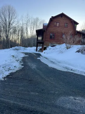 Log  cabin on Macintosh Pond access to VAST trail system snowmobile trails.