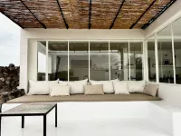 An architectural oasis with large swimming pool, along a breath-taking scenery.