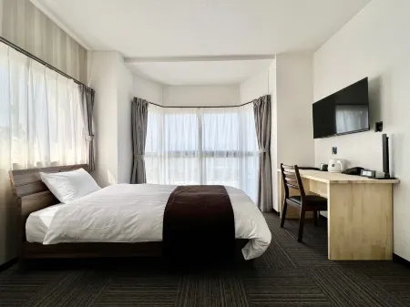 Guest House Ecott Tanegashima Отели рядом с достопримечательностью «Nishinoomote port offshore Breakwater north Lighthouse»