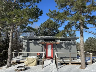 The Adventure Center rustic tiny cabin hot tub access stage stars sunsets & pets
