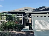 Cheerful 4 Bed, 3 Bath Home with Screened Pool