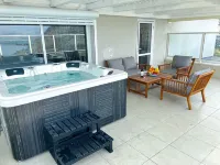sea view penthouse with 3 floors and an hot tub! can host up to 15 people .