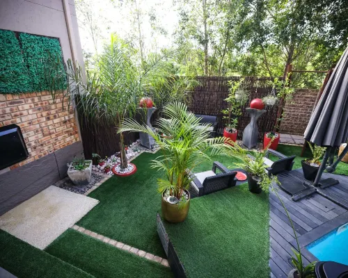 Luxury 2-Bedroom Apartment Near or Tambo with Private Garden & Heated Pool Hotels in Benoni