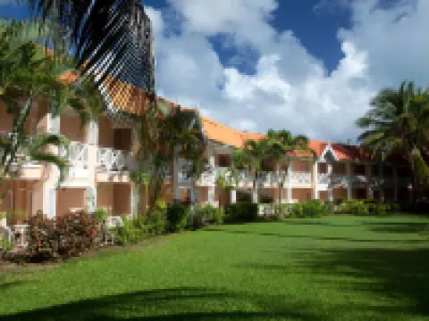 Coco Reef Resort & Spa Hotels near A.N.R. Robinson International Airport