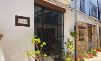 "a white building with a large window and a sign that says "" la galeria "" in front" at Apartamentos Turisticos "El Refugio"