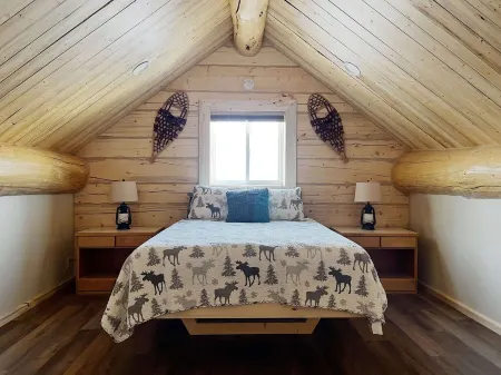 Beautiful hand-crafted log cabin on Horse Creek one block off Main Street.